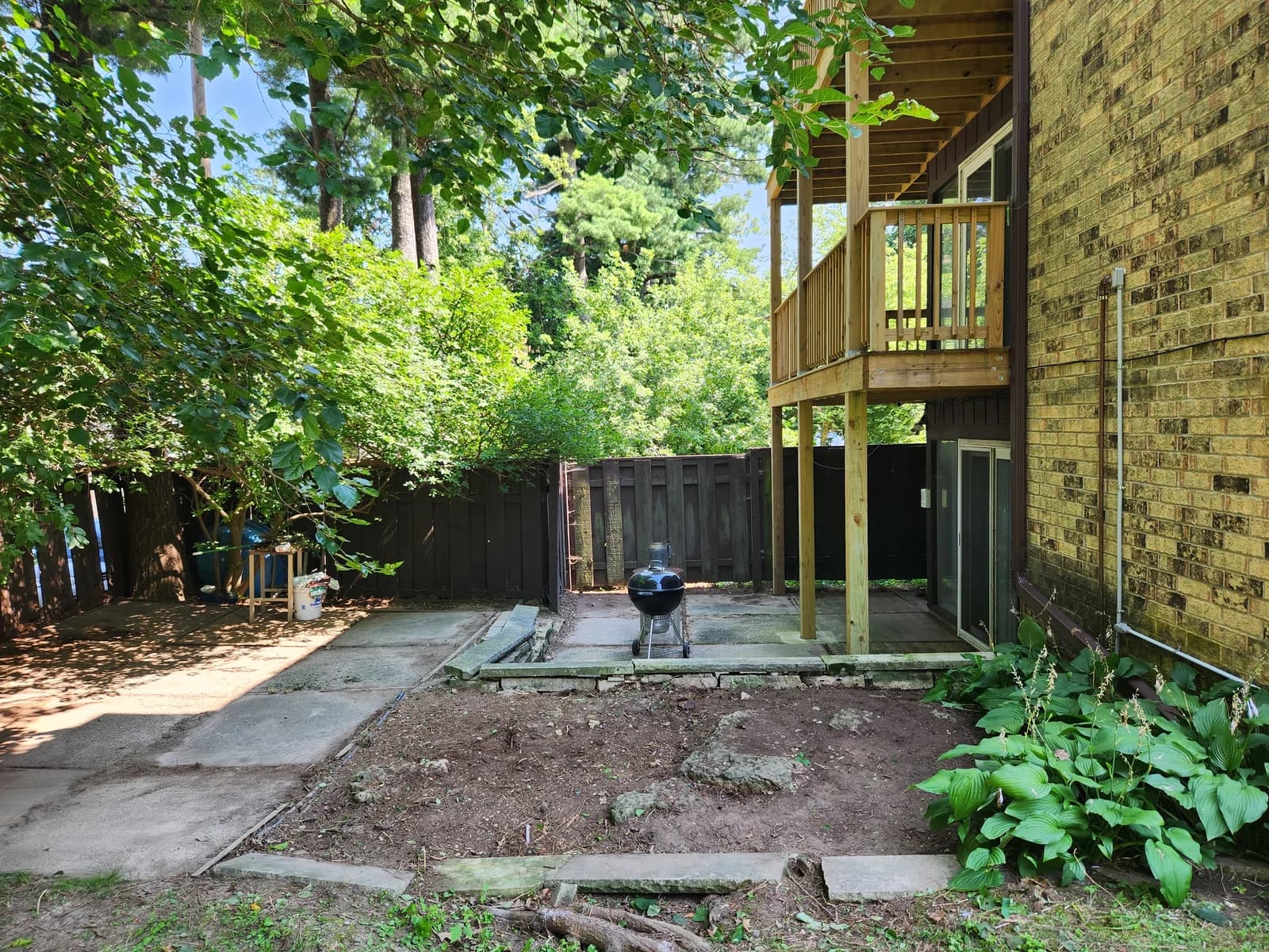 Cleared backyard with visible patio and clean outdoor space